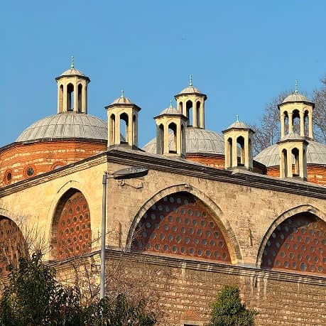 Ottoman brick domes and lantern turrets in low winter light