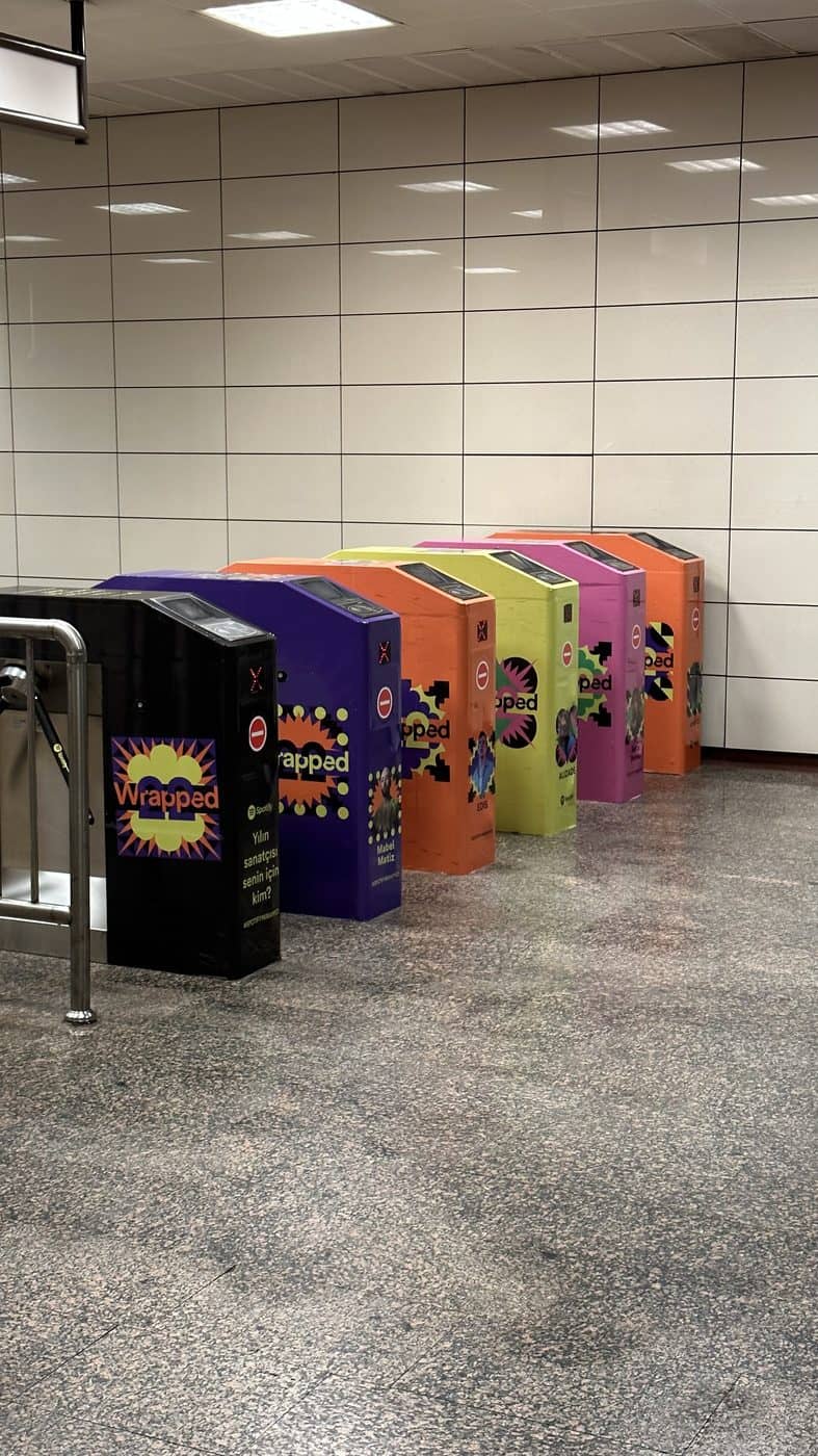 A row of brightly painted lockers in a tiled hall